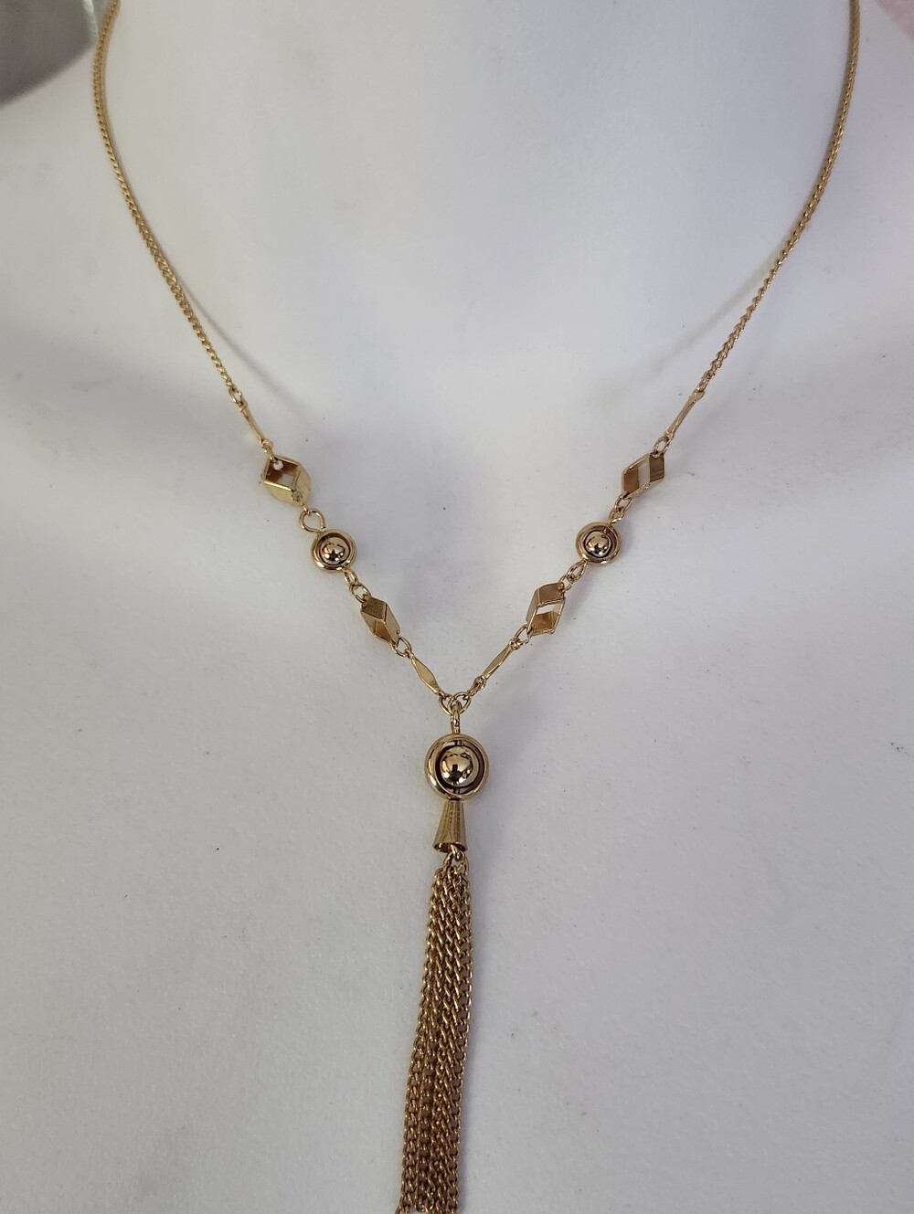 Elegant Gold Tone Tassel Y Necklace With Dainty Geometric Accents
